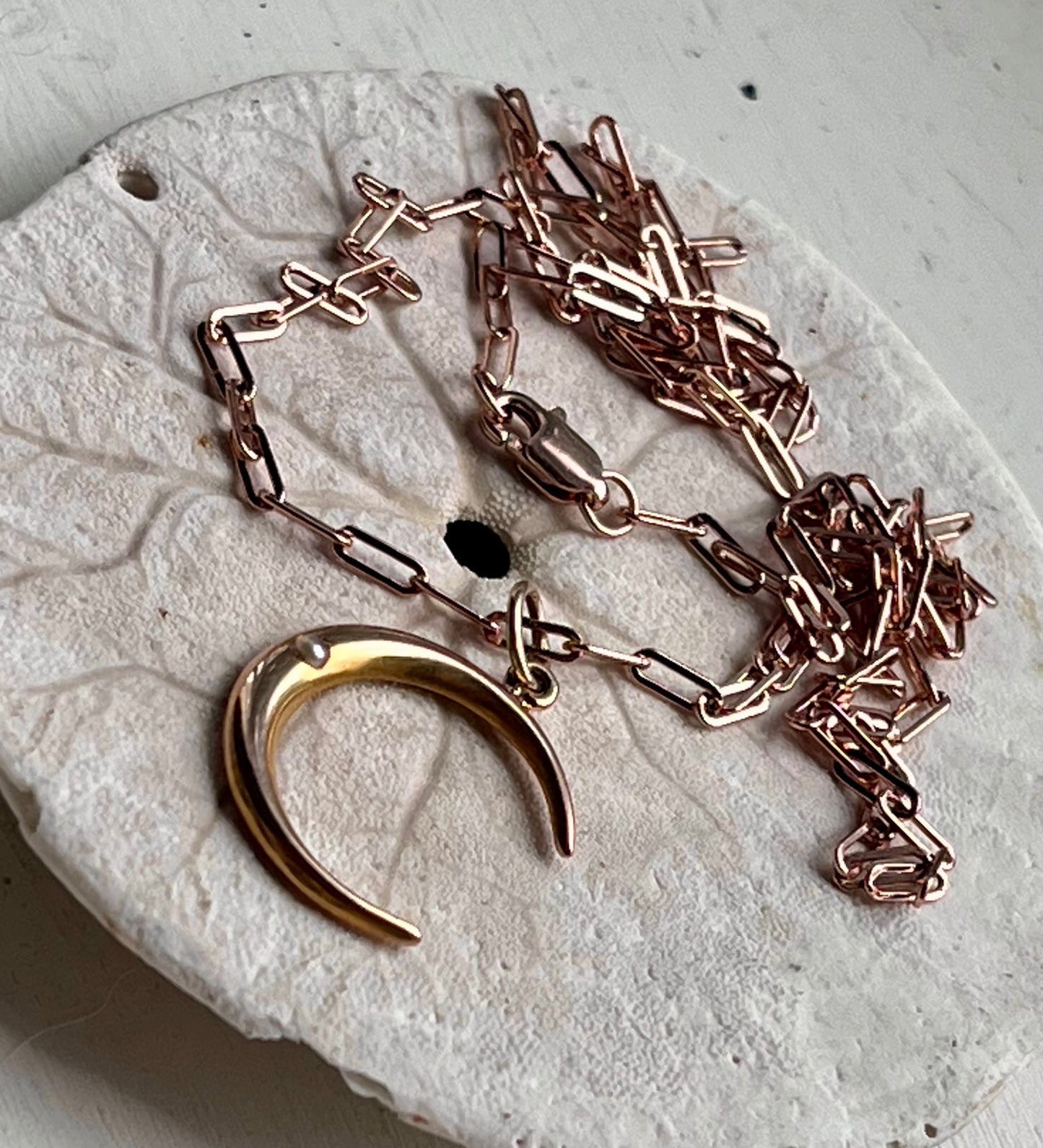 Crescent charm
