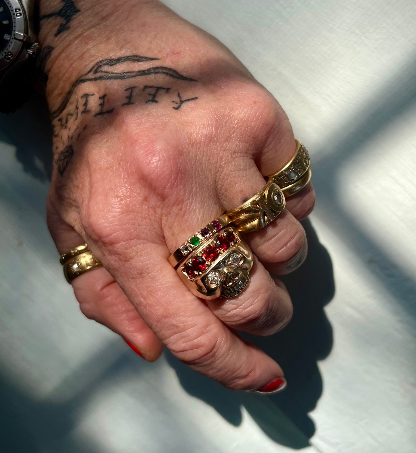 Acrostic gemstone DEAR ring