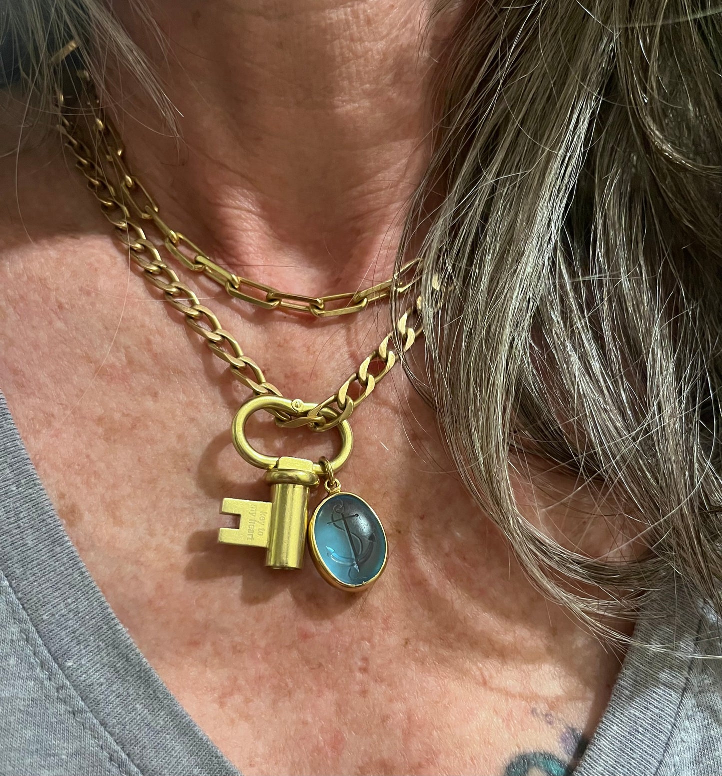 Topaz and 18k anchor pendant